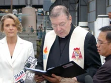 The Premier of New South Wales Kristina Keneally watches Cardinal Pell conduct the blessing. 