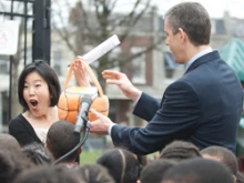 DC Public Schools Chancellor Michelle Rhee receives an Easter basket filled with 3,000 reserved tickets to the White House Easter Egg Roll from U.S. Education Secretary Arne Duncan