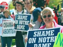 Pro-life protestors demonstrate against the honoring and invitation of President Obama.