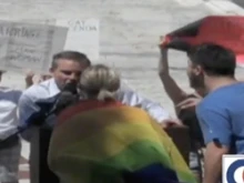 Homosexual activists stand in front of Brian Brown as he tries to address the traditional marriage rally in Providence.