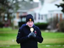 Fr. Bobby Krueger of St. Leonard in Berwyn, Ill., carries the Blessed Sacrament through his parish.