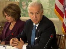 Vice President Joe Biden speaks at the health care summit while Rep. Nancy Pelosi listens.