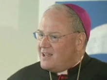 Archbishop Timothy Dolan speaks with reporters at Covenant House in New York City