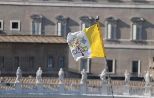 Vatican City flag from the view of the Pontifical Urban University in Rome, Italy on March 12, 2015 -  