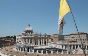 Vatican City - May 6, 2015. The flag of Vatican City with St. Peter's Basilica in the background -   Bohumil Petrik / CNA