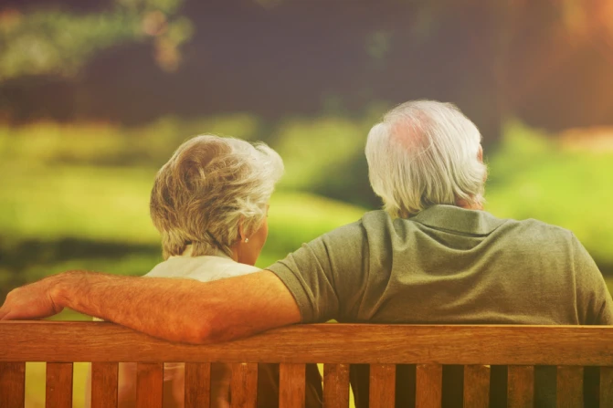 Elderly couple on a bench Creditvectorfusionart  Shutterstock