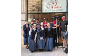 Sister and volunteers outside the Pauline bookstore in Chicago.   Sr. Tracey Matthia Dugas