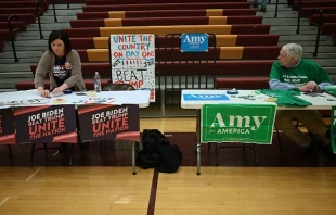 Precinct captains prepare for the opening of the Iowa Caucus at Lincoln High School in Des Moines, Iowa, Feb. 3, 2020.   Jim Watson/AFP via Getty