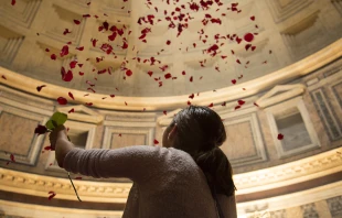 Rose petals shower from the ceiling of the Pantheon, a Pentecost tradition in Rome symbolizing the descent of the Holy Spirit.   Marina Testino/CNA