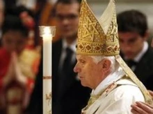 Pope Benedict leads the candel procession during the Easter Vigil