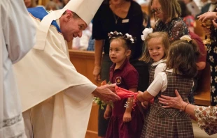 Bishop Michael F. Burbidge accepting the offertory gifts at the Mass for Persons with Disabilities, Sept. 29.   ZOEY MARAIST/Arlington Catholic Herald