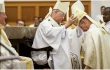 Vancouver Archbishop J.. Michael Miller, left, watches as Edmonton Archbishop Richard Smith places the mitre on Father Gary Franken at his ordination as bishop of St. Paul, Alberta, Canada, in December 2022. Archbishop Smith has been appointed the next archbishop of Vancouver after Pope Francis accepted Archbishop Miller's retirement.