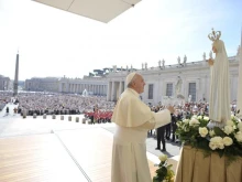 Pope Francis in front of a statue of Our Lady of Fatima in St. Peter’s Square on May 13, 2015.