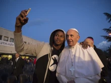 Pope Francis visits a reception center for asylum seekers in Castelnuovo di Porto, north of Rome, on March 24, 2016.