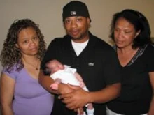 Left to Right: Martha Motley, Jovan with his son, and Esmeralda Abreu, the mother of Benny.  Photo 