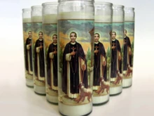 The candles being sold with President Obama superimposed over St. Martin