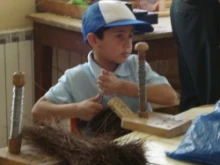 A student makes a broom at the Al-Ala'iya School for the Blind