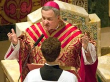 Archbishop Robert Carlson prays at his installation Mass