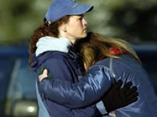 One woman comforts another in front of New Life Church in Colorado Springs; Photo 