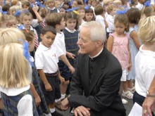 Archbishop Donald Wuerl visiting with students at Little Flower Schoool