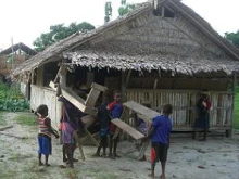 Children salvage materials to help rebuild the church on Gaomai