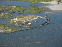 Containment boom is deployed at the Breton National Wildlife Refuge on Thursday. 