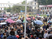 Catholics erect a cross in front of the former Vatican embassy