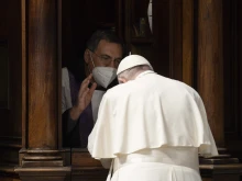 Pope Francis goes to confession during a penance service in St. Peter's Basilica on March 25, 2022.