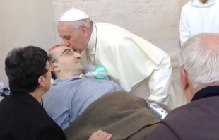 Pope Francis greets Salvatore D'argento on Sept. 10, 2014.   Alan Holdren/CNA.