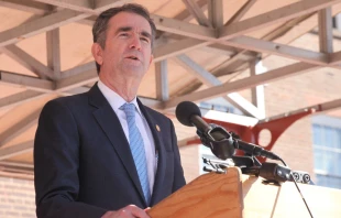 Virginia Governor, Ralph Northam speaking in front of Alexandria City Hall, March 2019.   Eli Wilson/Shutterstock