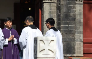 Chinese Catholic priest at St. Michael's Church, Beijing, March, 2016.   Mirko Kuzmanovic/Shutterstock