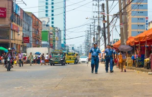 Police officers patrol city streets in Philippines.   Allen.G / Shutterstock