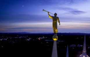 Angel Morosi statue atop playing a song to the rising crescent moon from atop the Mormon Temple in Portland, Oregon.   Air Time Dronography/Shutterstock