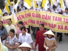 Vietnamese Catholics, young and old, march in protest of police brutality