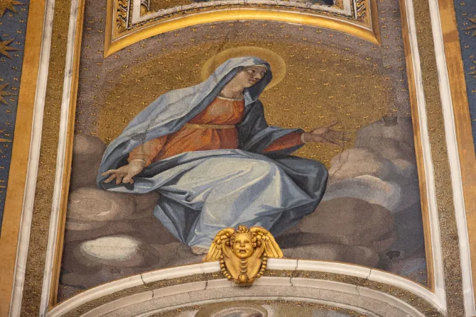The mosaics decorating the interior dome of St. Peter's Basilica depict the Blessed Virgin Mary next to Christ the Redeemer and the Apostles.