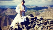 Father John Nepil of the Archdiocese of Denver celebrates Mass on top of Wetterhorn Peak in the San Juan Mountains in Colorado.