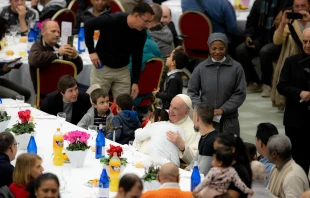 Pope Francis receives a hug from a child during lunch on the World Day of the Poor Nov. 13, 2022. Daniel Ibáñez / CNA