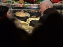 Worshippers gather to pray in front of the exhumed body of mystic-saint Padre Pio in the Catholic Church of San Lorenzo fuori le Mura (St. Lawrence Outside the Walls) in Rome on Feb. 4, 2016.