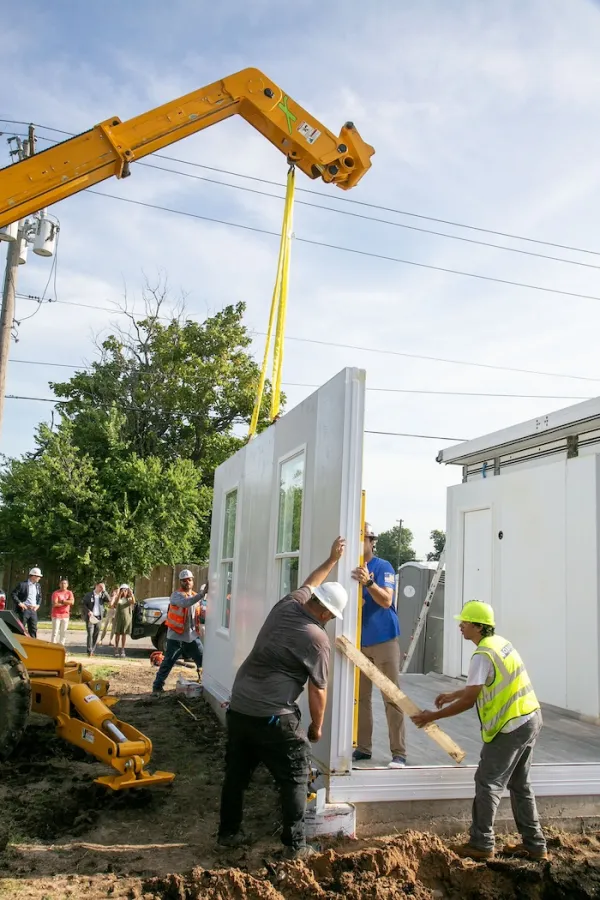 Workers assemble units in Catholic Charities of the Archdiocese of Oklahoma City's "Caritas Casitas" neighborhood on Tuesday, Aug. 13, 2024. Credit: Catholic Charities of the Archdiocese of Oklahoma City