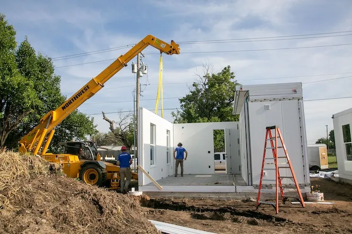 Workers assemble units in Catholic Charities of the Archdiocese of Oklahoma City's "Caritas Casitas" neighborhood on Tuesday, Aug. 13, 2024.?w=200&h=150