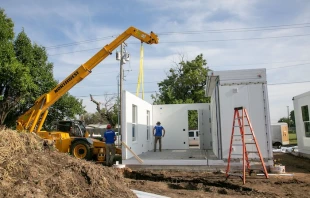 Workers assemble units in Catholic Charities of the Archdiocese of Oklahoma City's "Caritas Casitas" neighborhood on Tuesday, Aug. 13, 2024. Credit: Catholic Charities of the Archdiocese of Oklahoma City.