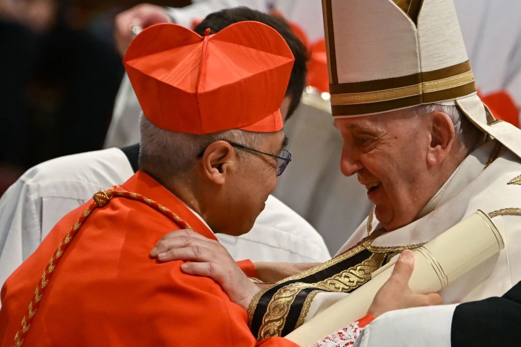 Pope Francis speaks to Archbishop William Seng Chye Goh (left) after he elevated him to cardinal during a consistory to create 20 new cardinals on Aug. 27, 2022, at St. Peter’s Basilica at the Vatican.?w=200&h=150