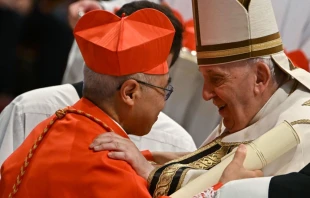 Pope Francis speaks to Archbishop William Seng Chye Goh (left) after he elevated him to cardinal during a consistory to create 20 new cardinals on Aug. 27, 2022, at St. Peter’s Basilica at the Vatican. Credit: Alberto Pizzoli