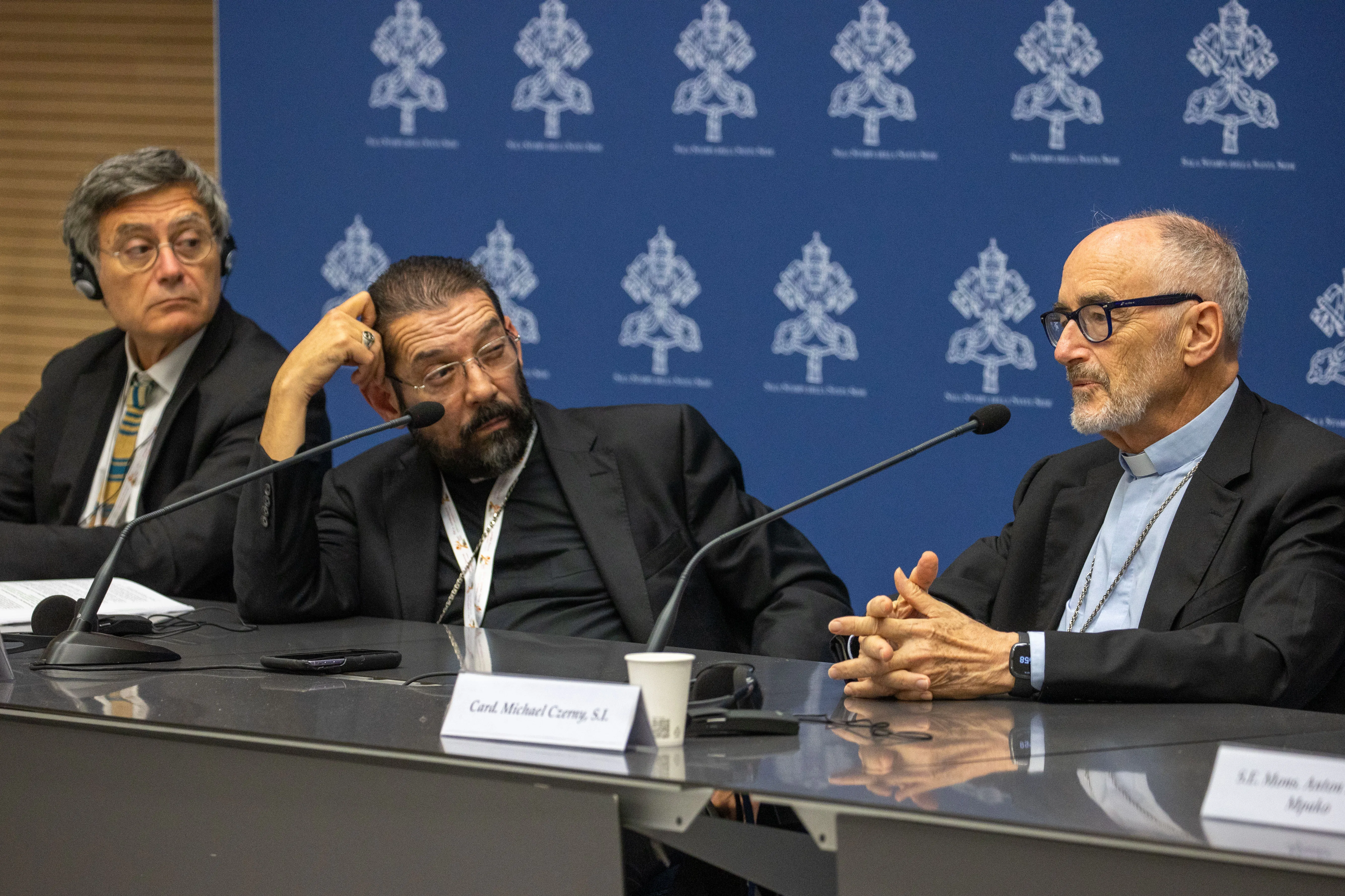 Paolo Ruffini, president of the synod’s communication commission (left); Bishop Daniel Flores of Brownsville, Texas (center); and Cardinal Michael Czerny (right) at a press briefing on Oct. 19, 2023.?w=200&h=150