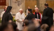 Pope Francis and Archbishop of Canterbury Justin Welby exchange greetings with other Christian leaders at an ecumenical second vespers at the Basilica of St. Paul Outside the Walls in Rome on the feast of the Conversion of St. Paul, Jan. 25, 2024.