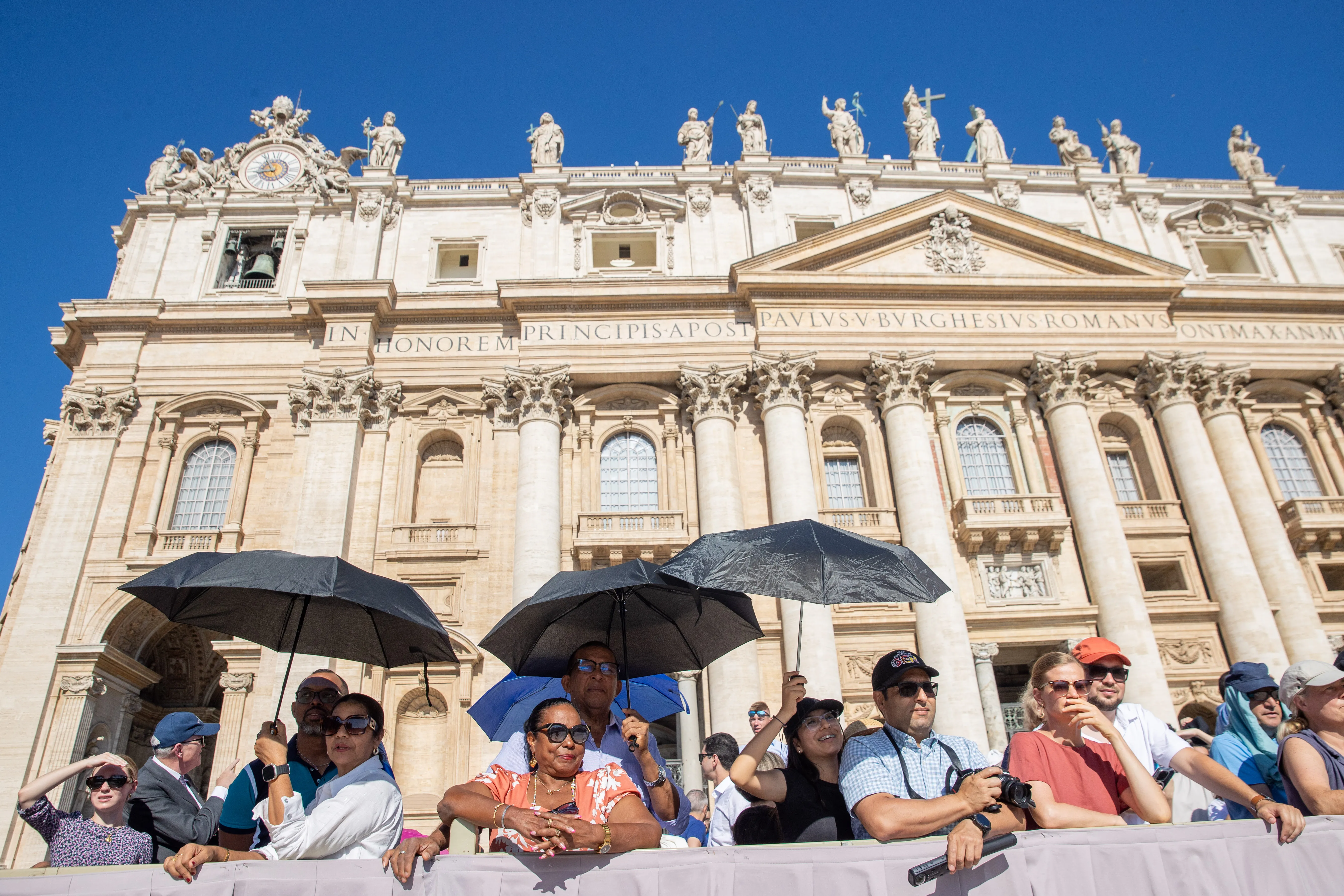 Pilgrims shield themselves from the sun at Pope Francis' general audience in St. Peter's Square at the Vatican, Wednesday, June 26, 2024.?w=200&h=150