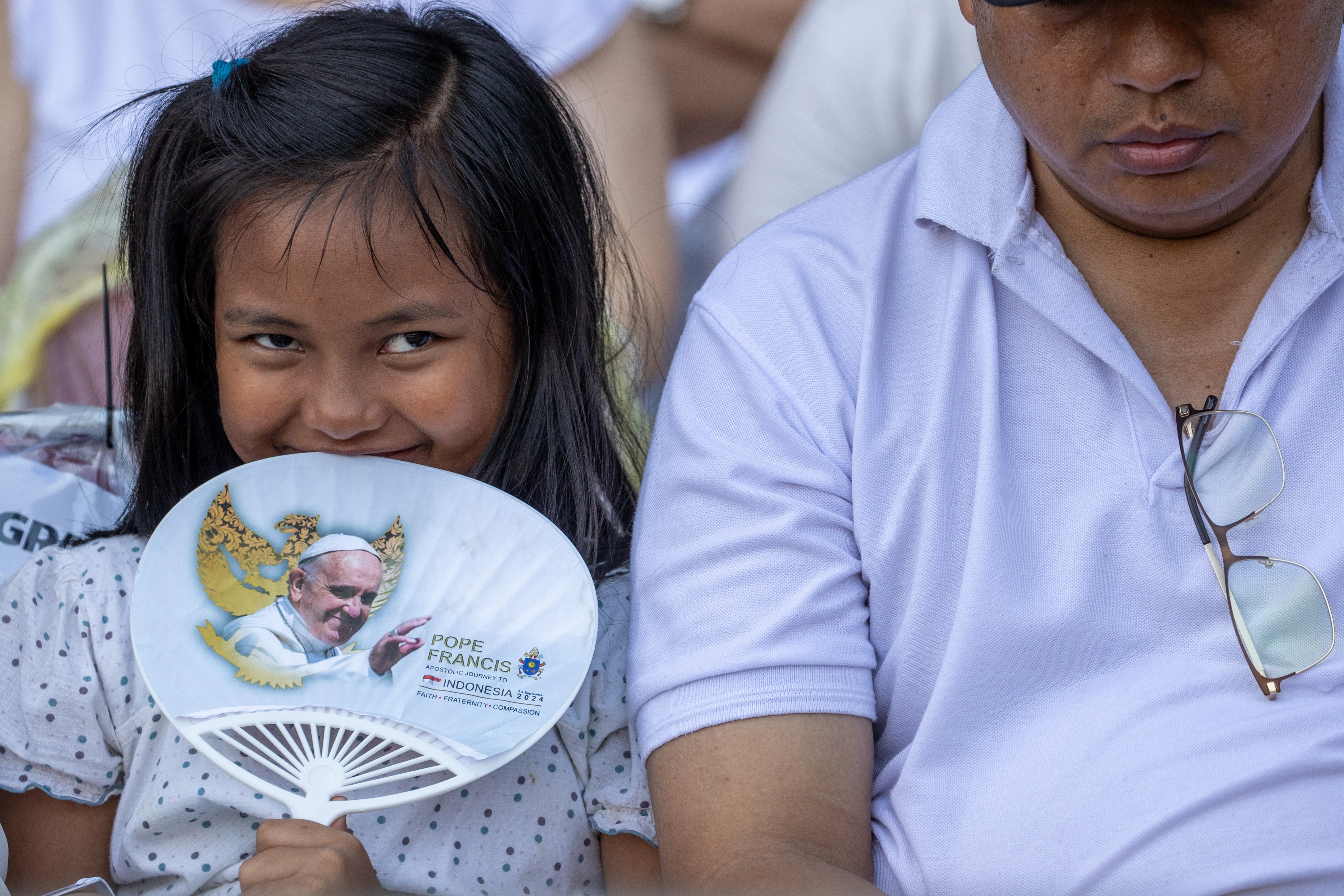 A young Catholic attends the papal Mass at Gelora Bung Karno Stadium in Jakarta on Thursday, Sept. 5, 2024.?w=200&h=150