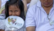 A young Catholic attends the papal Mass at Gelora Bung Karno Stadium in Jakarta on Thursday, Sept. 5, 2024.