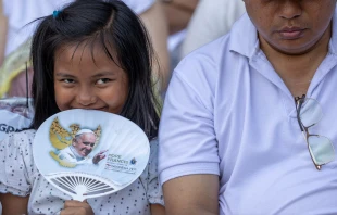 A young Catholic attends the papal Mass at Gelora Bung Karno Stadium in Jakarta on Thursday, Sept. 5, 2024. Credit: Daniel Ibáñez/CNA