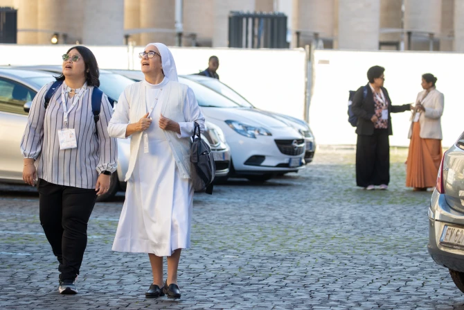 Synod participants arrive for the morning prayer on Oct. 24, 2024, at the Vatican.